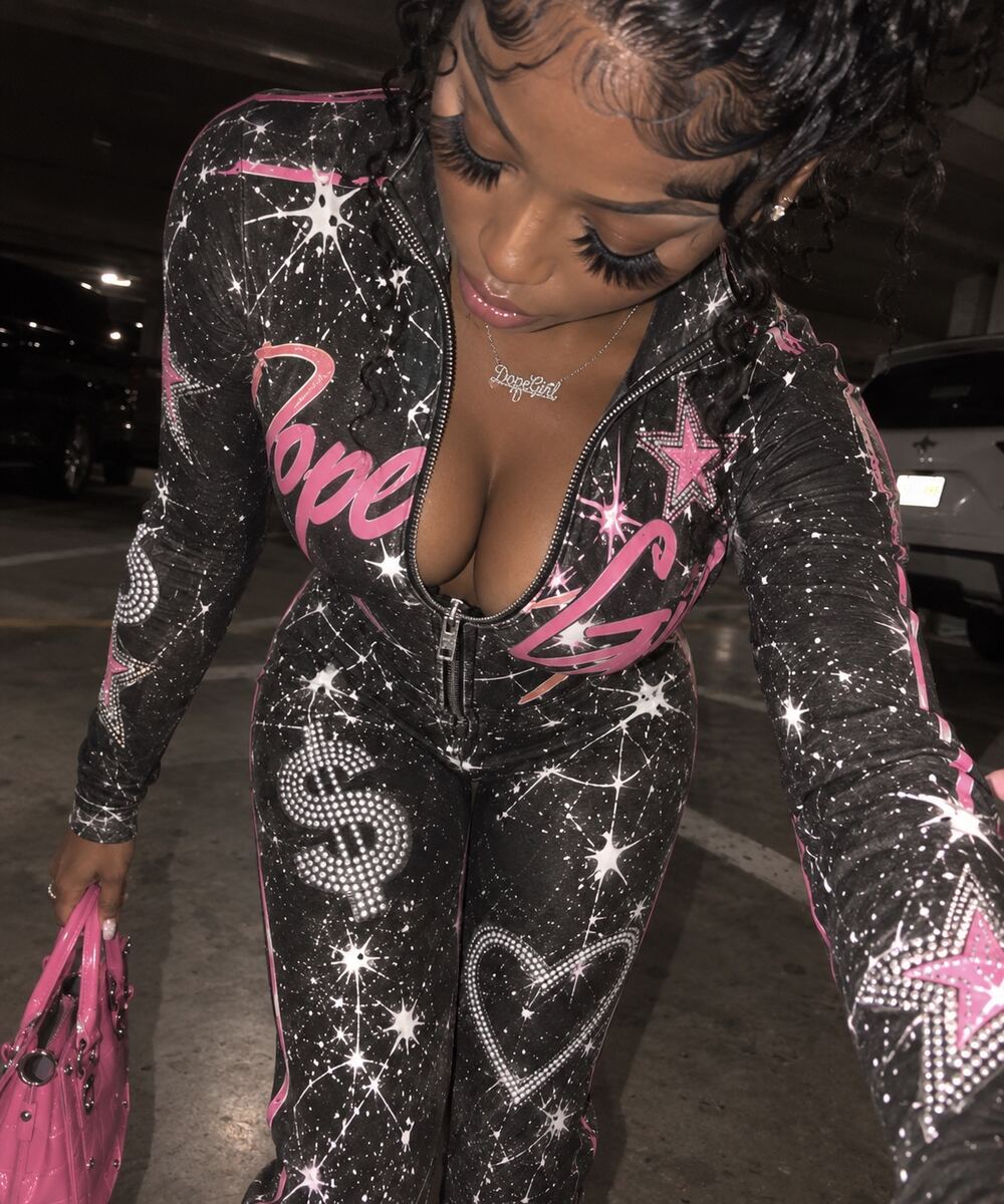 Close-up of the zip front and rhinestone-inspired catsuit graphics